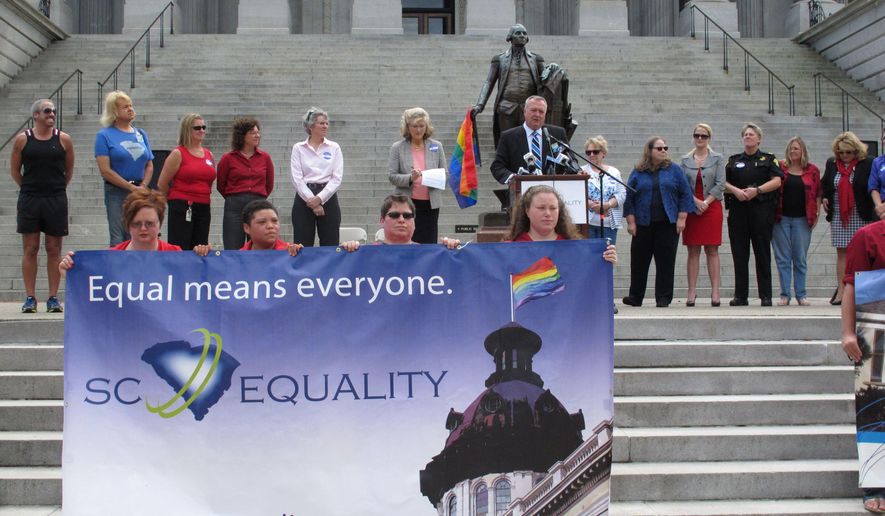 South Carolina Equality Board Chairman Jeff Ayers, speaks at a Statehouse rally on Wednesday, Oct. 8, 2014, in Columbia, S.C. Supporters of gay marriage held a rally at the capitol the same day a Charleston County Probate judge approved an application for a same-sex marriage license. (AP Photo/Jeffrey Collins)