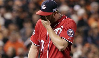 Washington Nationals pitcher Aaron Barrett (30) walks off after giving up a run on a wild pitch in the seventh inning against the San Francisco Giants during Game 4 of baseball&#39;s NL Division Series in San Francisco, Tuesday, Oct. 7, 2014. (AP Photo/Marcio Jose Sanchez)
