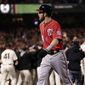 Washington Nationals right fielder Bryce Harper walks off the field after Game 4 of baseball&#x27;s NL Division Series in San Francisco, Tuesday, Oct. 7, 2014. The Giants beat the Nationals 3-2 to advance to the next round. (AP Photo/Marcio Jose Sanchez)
