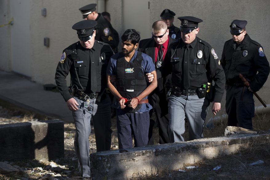 FILE - In this Nov. 28, 2012, file photo, Raghunandan Yandamuri is escorted from a Montgomery County district court after a preliminary hearing in Bridgeport, Pa. Yandamuri, accused of killing a 10-month-old girl and her grandmother in what prosecutors described as a kidnapping plot gone wrong has been convicted of murder. The Philadelphia Inquirer reports he was expressionless as the verdict against him was read Thursday, Oct. 9, 2014. The 27-year-old faces the possibility of the death penalty for the 2012 slayings of Saanvi Venna and grandmother Satayrathi Venna. (AP Photo/Matt Rourke, File)