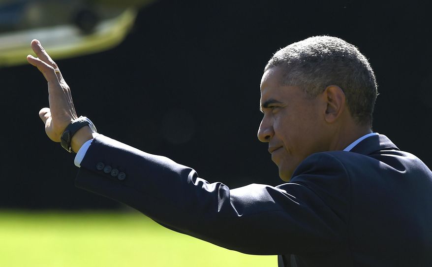 President Barack Obama waves as he walks to Marine One on the South Lawn of the White House in Washington, Thursday, Oct. 9, 2014, for a short trip to Andrews Air Force Base, Md., then onto California for three days. (AP Photo/Susan Walsh)