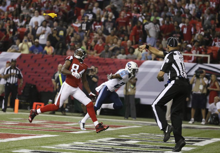 FILE - In this Aug. 23, 2014, file photo, Atlanta Falcons wide receiver Roddy White (84) waits for the ball as back judge Tony Steratore throws a penalty flag against the Tennessee Titans during the first half of an NFL preseason football game in Atlanta. The NFL's emphasis on defensive-backfield penalties has contributed to an average of more than two extra flags every game this season, a 15 percent rise from 2013. (AP Photo/David Goldman, File)