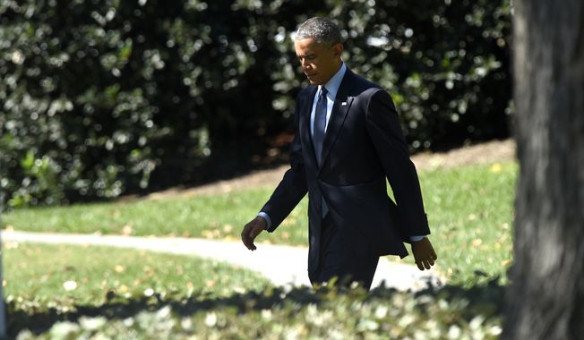 President Barack Obama walks to Marine One on the South Lawn of the White House in Washington, Thursday, Oct. 9, 2014, for a short trip to Andrews Air Force Base, Md., then onto California for three days. (AP Photo/Susan Walsh)