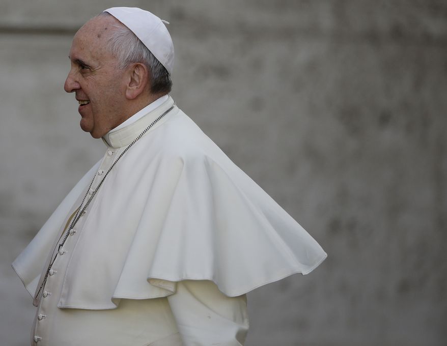 Pope Francis arrives for an afternoon session of a two-week synod on family issues at the Vatican, Thursday, Oct. 9, 2014. (AP Photo/Gregorio Borgia)