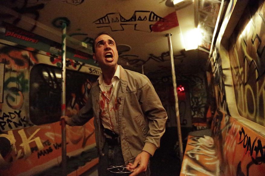 In this Oct. 2, 2014 photo, an actor performs during “Nightmare: New York,” a haunted house attraction in New York. The “Nightmare” Lower East Side house transports visitors to the city’s “bad old days,” including the demented rat-and-crime infested subway of the 1980s. (AP Photo/Frank Franklin II)