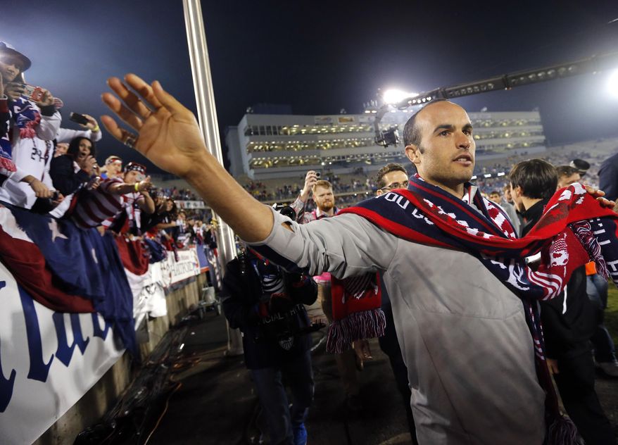 United States' Landon Donovan celebrates with fans after an exhibition soccer match against Ecuador in East Hartford, Conn., Friday, Oct. 10, 2014. Donovan made his last international soccer appearance Friday. (AP Photo/Elise Amendola)