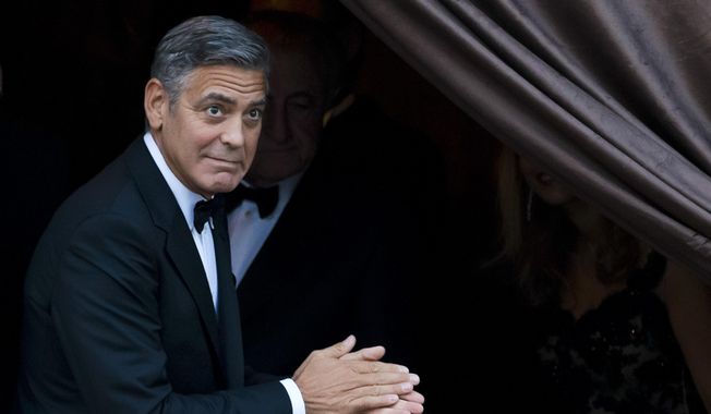 In this Sept. 27, 2014, file photo, George Clooney arrives at the Aman hotel in Venice, Italy. Clooney made an appearance at New York Comic Con, Thursday, Oct. 9, 2014, for a panel on his upcoming film, &amp;quot;Tomorrowland.&amp;quot;  (AP Photo/Andrew Medichini) ** FILE **