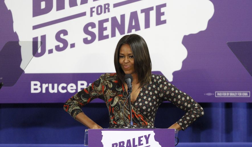 First Lady of the United States Michelle Obama speaks to the crowd at the Iowa Votes Rally on Friday, Oct. 10, 2014 at the Drake Fieldhouse in Des Moines. Obama was there to stump for U.S. Senate candidate Bruce Braley. (AP Photo/The Des Moines Register, Kelsey Kremer)