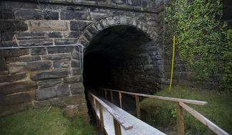 CORRECTS DATE TO SEPT. 30, 2014, NOT OCT. 7 - FOR RELEASE SATURDAY, OCT. 11, 2014 AT 9:00 A.M. EDT - This Sept. 30, 2014 photo shows the old abandoned railroad tunnel at Amazement Square in Lynchburg, Va., that will be transformed into a &amp;quot;glow zone&amp;quot; for the Fall Festival scheduled for Oct. 11, 2014. (AP Photo/News &amp;amp; Daily Advance, Autumn Parry)