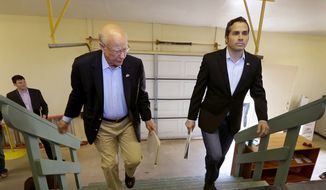 FILE - In this Sept. 6, 2014 file photo Republican Sen. Pat Roberts, left, and Greg Orman walk to the stage before a Senate debate in Hutchinson, Kan. Orman, an independent candidate challenging Roberts for the U.S. Senate in Kansas, has turned a longshot independent bid into a threat to the GOP veteran. Even if Roberts survives the challenge from independent Orman, Republicans also must lock down South Dakota, a once-unthinkable concern. (AP Photo/Charlie Riedel, File)