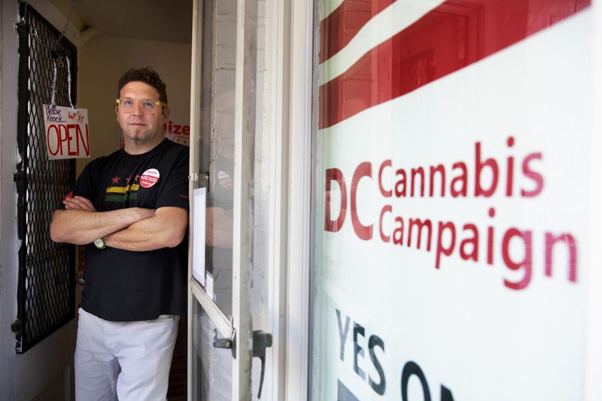 In this photo taken Oct. 9, 2014, Adam Eidinger, chairman of the DC Cannabis Campaign, poses for a portrait at the DC Cannabis Campaign headquarters, where he works in support of DC Ballot Initiative 71 to legalize small amounts of marijuana for personal use, in Washington. Legalized weed would look far different in the nation&#39;s capital than it does in other places that have chosen to decriminalize marijuana. Even if voters approve it next month, as appears likely, it would remain banned in the roughly one-fourth of the District of Columbia that is federal land, so there would still be no lighting a joint in front of the Jefferson Memorial. The capital also remains under the thumb of Congress, which could quash legalization in D.C. regardless of what the voters want. (AP Photo/Jacquelyn Martin) 