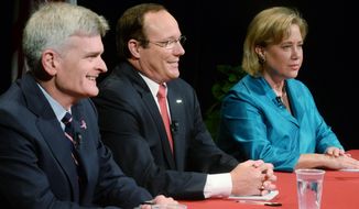 From left, Rep. Bill Cassidy, retired Air Force Col. Rob Maness, and Sen. Mary Landrieu wait moments before the debate, Tuesday, Oct. 14, 2014 at Centenary College in Shreveport, La. (AP Photo/The Shreveport Times, Henrietta Wildsmith)