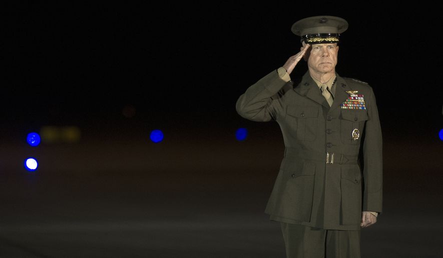 Marine Corp Commandant Gen. James Amos salutes during a Dignified Transfer for the remains of three Marines, Monday, June 23, 2014, at Dover Air Force Base, Del. According to the Department of Defense, Marines died June 20, Staff Sgt. David H. Stewart, 34, of Stafford, Va., Lance Cpl. Brandon J. Garabrant, 19, of Peterborough, N.H., and Lance Cpl. Adam F. Wolff, 25, of Cedar Rapids, Iowa, were killed while conducting combat operations in Helmand province, Afghanistan, in support of Operation Enduring Freedom. (AP Photo/Cliff Owen)