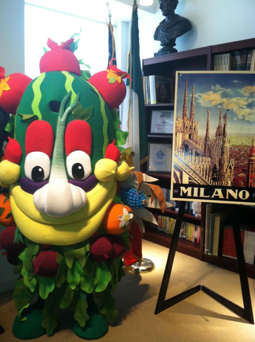 Foody, the mascot for the Milan Expo, is displayed at the offices of the Italian National Tourist Board in New York on Tuesday, Oct. 14, 2014. Food will be the primary theme of the Expo, which is the modern incarnation of the old world's fair. The event opens in May for six months and officials say they expect 20 million visitors, with more than a third coming from outside Italy. (AP Photo/Beth J. Harpaz)
