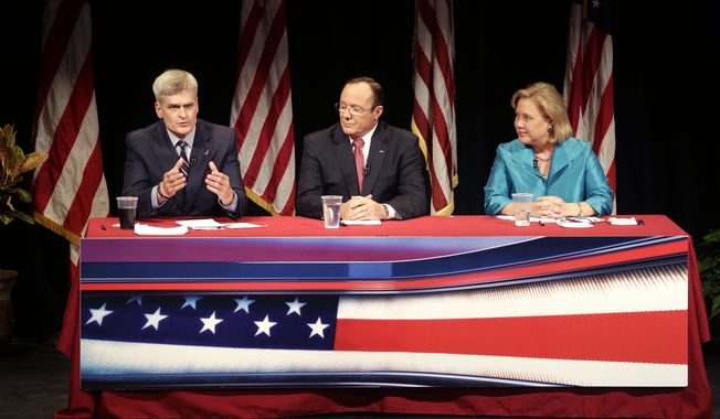 Republican Rep. Bill Cassidy (left), Republican candidate Rob Maness and Democratic Sen. Mary Landrieu (right), participate in a debate at Centenary College in Shreveport, Louisiana. (AP Photo/Gerald Herbert)