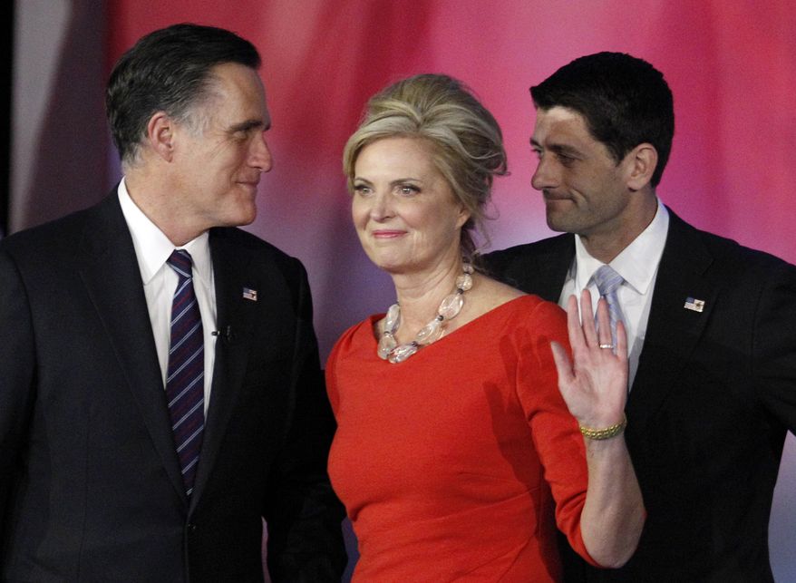FILE - In this Nov. 7, 2012, file photo, Republican presidential candidate and former Massachusetts Gov. Mitt Romney, left, speaks to his running mate, vice presidential candidate, Rep. Paul Ryan, right, R-Wis., as Romney&#39;s wife Ann waves to supporters after Romney conceded the race during his election night rally in Boston. Romney and his wife Ann announce an initiative to accelerate treatment and cures for complex neurological diseases, in partnership with Boston&amp;#8217;s Brigham and Women&amp;#8217;s Hospital. (AP Photo/Stephan Savoia, File)