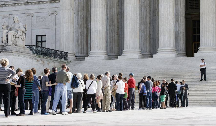 Visitors line up to enter the Supreme Court in Washington, Tuesday, Oct. 14, 2014, as the justices begin the second week of the new term. The landscape has changed very quickly for gay marriage in the U.S. Last week, the Supreme Court declined to hear appeals from several states seeking to retain their bans on same-sex marriage. The Oct. 6 move effectively legalized gay marriage in about 30 states and triggered a flurry of rulings and confusion in lower courts across the nation. (AP Photo/J. Scott Applewhite)