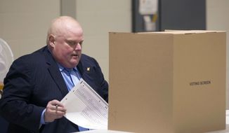 Toronto Mayor Rob Ford sits to down to cast his ballot in advance voting for the Toronto Municipal Election at a polling station in the Etobicoke area of Toronto, on Tuesday, Oct. 14, 2014. Ford, who is between chemotherapy treatments for a rare and aggressive form of cancer, says he wanted to support his brother Doug Ford&#39;s bid for the mayor&#39;s job. (AP Photo/The Canadian Press, Chris Young)