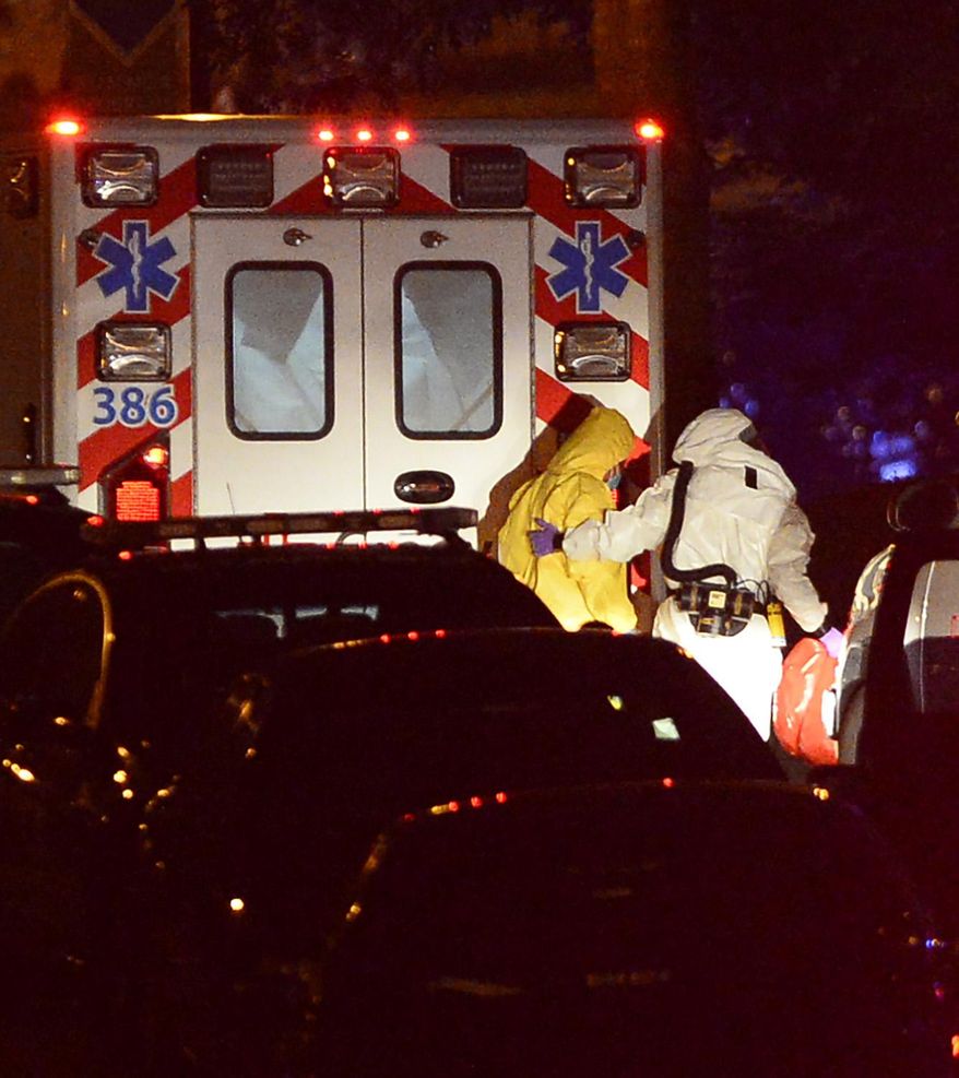 Amber Vinson, the second health care worker to be diagnosed with Ebola in Texas, arrives at Emory University Hospital on Wednesday, Oct. 15, 2014 in Atlanta. A joint emergency isolation unit administered by Emory University Hospital and the Centers for Disease Control and Prevention has successfully treated two Americans and is currently treating a third. (AP Photo/David Tulis)