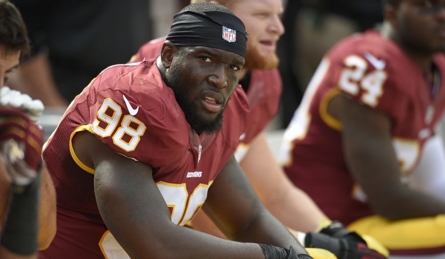 Washington Redskins outside linebacker Brian Orakpo (98) looks on from the bench during the second half of an NFL football game against the Jacksonville Jaguars, Sunday, Sept. 14, 2014, in Landover, Md. The Redskins won 41-10. (AP Photo/Nick Wass) **FILE**