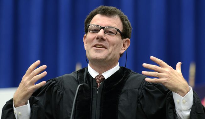 Nicholas Kristof (above, at Syracuse University&#x27;s 2013 commencement) was taking hits from his liberal media compatriots this week. (Kevin Rivoli/AP Images for Syracuse University)