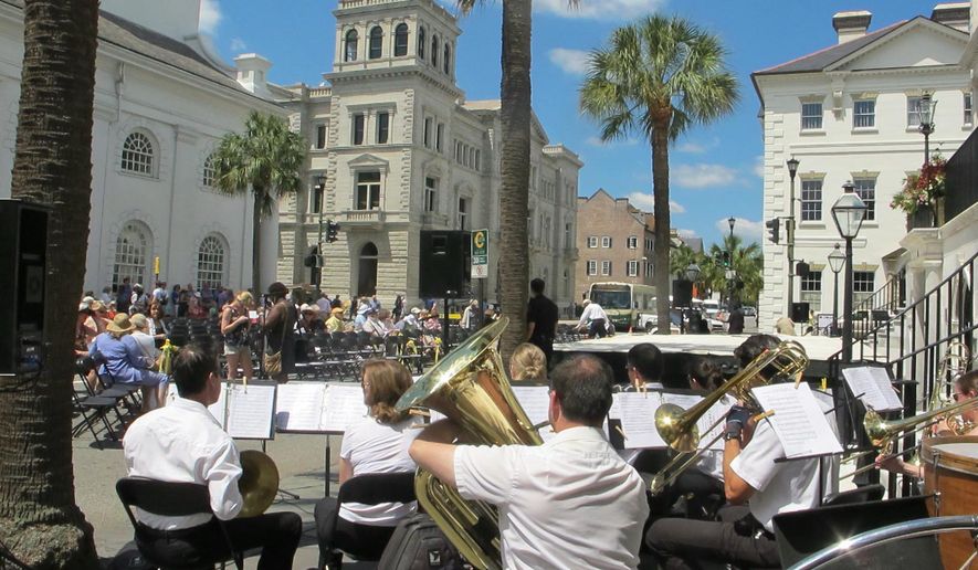 The Charleston Symphony Orchestra Brass Ensemble performs as the audience gathers for the opening ceremonies of the Spoleto Festival USA in Charleston, S.C. Tourism leaders met in Charleston from Oct. 14, 2014 through Oct. 16, 2014 for a meeting of the Southeast Tourism Society. The group said that congressional reauthorization of Brand USA, a program to attract foreign visitors, and fixing the highway infrastructure are key issues in the 12-state region where tourism pumps $210 billion annually into the economy. (AP Photo/Bruce Smith, File)