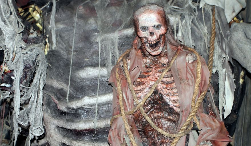 Visitors witness grisly effects at Bennett's Curse in Jessup, Maryland. (Photograph by Jacquie Kubin / Special to The Washington Times)