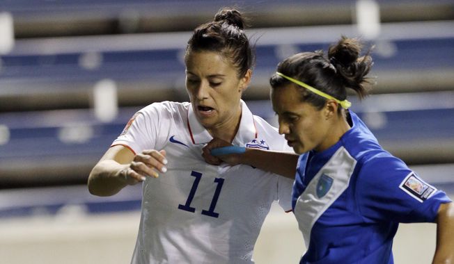 United States&#x27; Ali Krieger, left, controls the ball against Guatemala&#x27;s Marilyn Rivera during the first half of a CONCACAF Women&#x27;s Championship soccer game Friday, Oct. 17, 2014, in Bridgeview, Ill. (AP Photo/Nam Y. Huh)