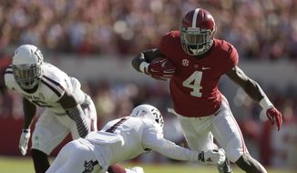 Alabama running back T.J. Yeldon (4) runs the against Texas A&amp;M defensive back De&#39;Vante Harris (1)during the first half of an NCAA college football game on Saturday, Oct, 18, 2014, in Tuscaloosa, Ala. (AP Photo/Brynn Anderson)