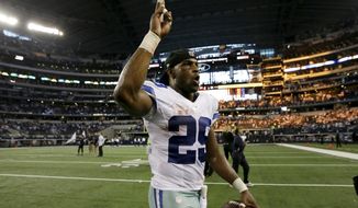 Dallas Cowboys running back DeMarco Murray celebrates a 31-21 win as he walks off the field following their NFL football game agains the New York Giants, Sunday, Oct.  19, 2014, in Arlington, Texas. (AP Photo/Brandon Wade)