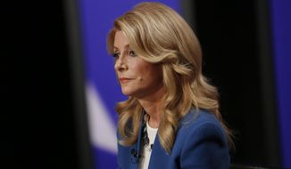 In this Sept. 30, 2014, file pool photo, Texas State Senator Wendy Davis, Democratic Gubernatorial candidate, responds to a question during the final gubernatorial debate in a KERA-TV studio in Dallas. Davis, a state senator, is scheduled to cast her ballot Monday, Oct. 20, in Fort Worth. Her television ads that magnified Abbott&#39;s use of a wheelchair and a 1990s rape lawsuit have drawn national attention and put her on the defensive from critics, but Davis hasn&#39;t backed down while trying to become the first Democrat in the governor&#39;s mansion since Ann Richards. (AP Photo/The Dallas Morning News, Andy Jacobsohn, Pool)