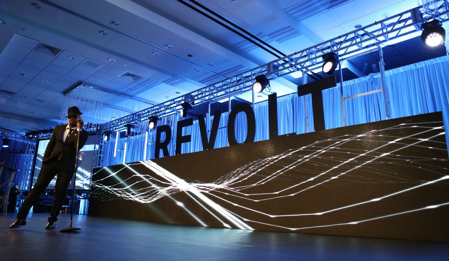 Ne-Yo sings during the REVOLT Music Conference Gala Dinner at Fontainebleau Miami Beach on Oct. 17, 2014, in Miami Beach, Florida. (Photo by Marc Serota/Invision for REVOLT/AP Images)