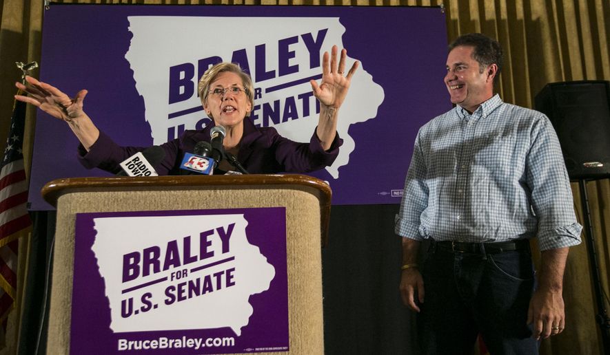 Senate candidate Bruce Braley, right,  campaigns with  U.S. Sen. Elizabeth Warren, D-Mass., in an Iowa Votes rally in Des Moines  Sunday, Oct. 19, 2014, at the Hotel Fort Des Moines . (AP Photo/The Des Moines Register, Rodney White)  MAGS OUT, TV OUT, NO SALES, MANDATORY CREDIT