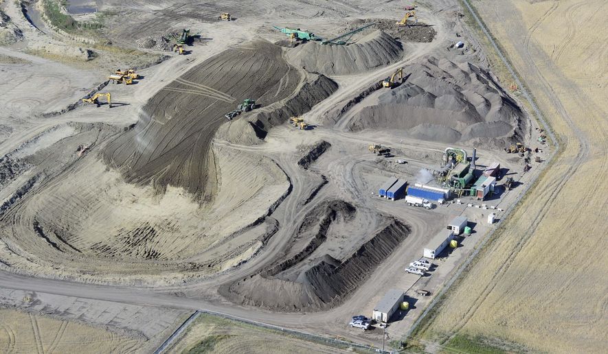 This September 2014 photo provided by Tesoro Corp., shows the site where around-the-clock cleanup continues one year after 20,000 barrels of oil spilled from a Tesoro pipeline break onto a farmer’s field in northwestern North Dakota near Tioga. The massive spill has been called the worst in state history. Tesoro blames a lightning strike for causing the rupture. (AP Photo/Courtesy of Tesoro Corp.)