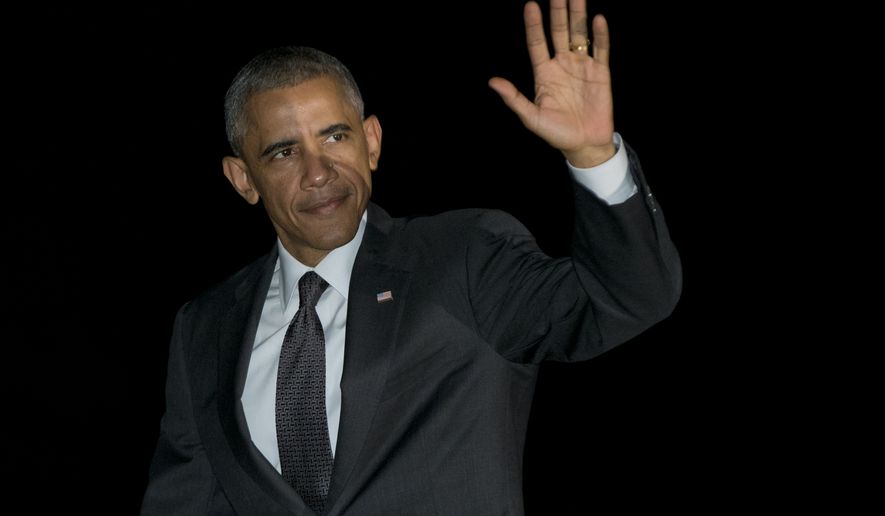 President Barack Obama waves as he walks from Marine One, across the South Lawn to the White House in Washington, Monday, Oct. 20, 2014, as he arrives from Chicago. (AP Photo/Carolyn Kaster)