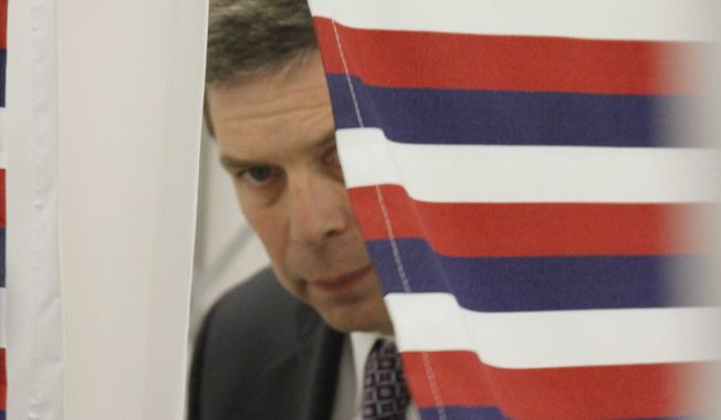 U.S. Sen. Mark Begich, D-Alaska, leaves the voting booth after casting his ballot at an early polling location on Monday, Oct. 20, 2014, in Anchorage, Alaska. Begich, a first-term incumbent, faces former Alaska Attorney General Dan Sullivan, a Republican, in the general election. (AP Photo/Mark Thiessen)