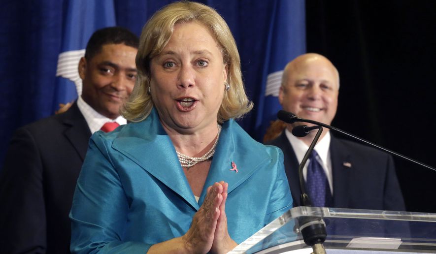 Sen. Mary Landrieu, D-La., speaks at a campaign event for her Senate race in Baton Rouge, La., Monday, Oct. 20, 2014. Behind are her brother, New Orleans Mayor Mitch Landrieu, and Rep. Cedric Richmond, D-La. (AP Photo/Gerald Herbert)