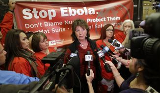 RoseAnn DeMoro, executive director of the California Nurses Association and National Nurses United  talks to reporters after meeting with Gov. Jerry Brown to discuss the Ebola crisis, Tuesday, Oct. 21, 2014, in Sacramento, Calif.   The Nurses unions, which have highly critical of the response so far, say they want California to be the national leader in enacting the highest Ebola safety standards. (AP Photo/Rich Pedroncelli) **FILE**