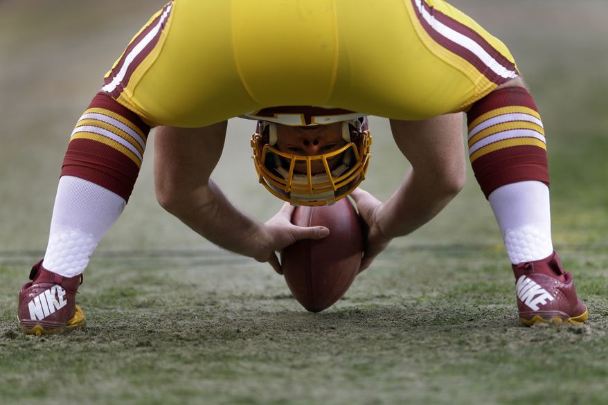 Washington Redskins long snapper Nick Sundberg prepares to snap the ball during the second half of an NFL football game against the Baltimore Ravens in Landover, Md., Sunday, Dec. 9, 2012. (AP Photo/Patrick Semansky)