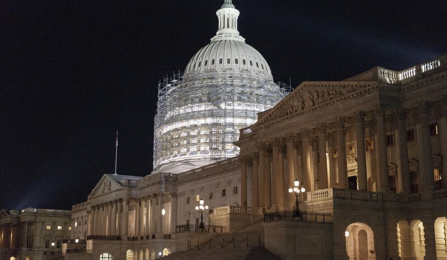 This photo taken Oct. 4, 2014, shows scaffolding around the Capitol Dome in Washington. (AP Photo/J. Scott Applewhite) ** FILE **