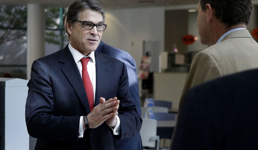 Texas Gov. Rick Perry speaks as he leaves a news conference at UT Southwestern Medical Center in Dallas, Tuesday, Oct. 21, 2014. Perry announced a North Texas Ebola treatment and infectious disease bio containment facility to be hosted at the Methodist Campus for Continuing Care in Richardson, Texas. (AP Photo/LM Otero)