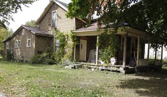 In this photo taken Oct. 11, 2014, an abandoned home in Kenton, Ohio. Long seen as having devastated Sun Belt cities, the subprime mortgage crisis unleashed turmoil on Ohio and other rural areas. Now federal officials are pledging regulatory attention and financial help. Subprime loans were distributed in the rural U.S. at even higher rates on average than in metropolitan counties. Much of it was concentrated in Appalachia and other areas stretching from Ohio, West Virginia and Kentucky to Mississippi, Louisiana, Texas and the Great Plains, according to government data provided to The Associated Press by researchers at the U.S. Department of Agriculture and Middlebury College.  (AP Photo/Jay LaPrete)