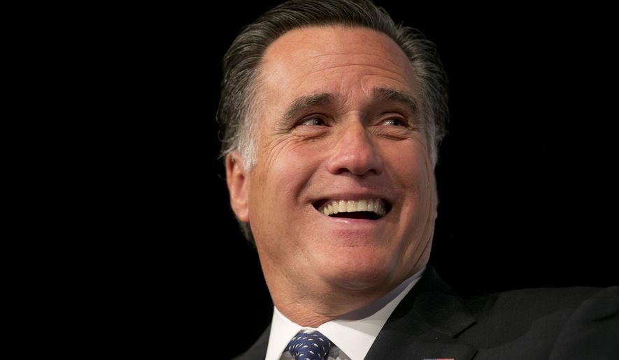 Former Massachusetts governor and Republican presidential nominee Mitt Romney laughs while speaking to members of the business community at the Boise Centre in Boise, Idaho, on Oct. 22, 2014. (Associated Press/The Idaho Statesman, Kyle Green) **FILE**