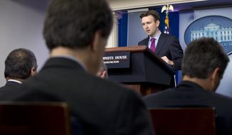 White House press secretary Josh Earnest speaks during his daily news briefing at the White House in Washington, Wednesday, Oct. 22, 2014, where he spoke about the shootings in Canada and answered questions about Ebola. (AP Photo/Jacquelyn Martin)