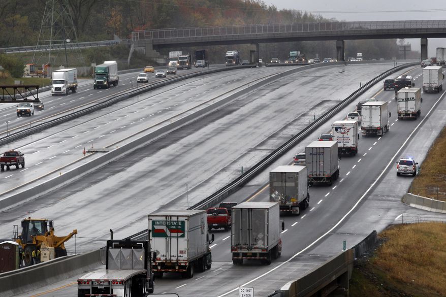 Traffic moves along the New Jersey Turnpike as work continues on new sections of the road Thursday, Oct. 23, 2014, in Hamilton Township, N.J. A $2.3 billion project to widen the turnpike from 6 to 12 lanes between Interchange 6, in Burlington County, and Interchange 9, in New Brunswick, is nearly complete. The northbound lanes are expected to open Saturday night, while the southbound lanes will open next weekend. (AP Photo/Mel Evans)