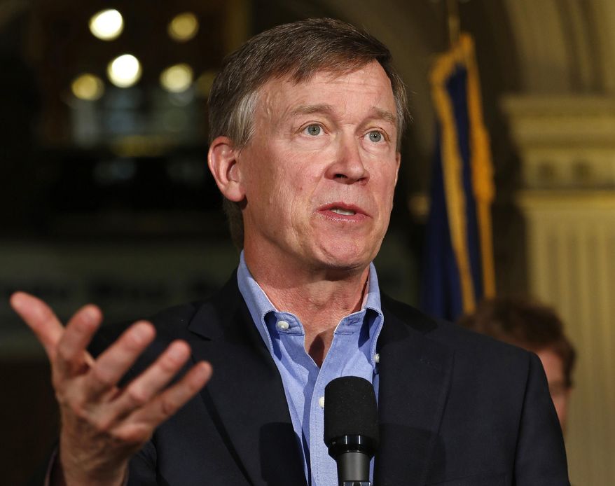 Colorado Gov. John Hickenlooper speaks at the Capitol in Denver on Aug. 4, 2014. (Associated Press) ** FILE **