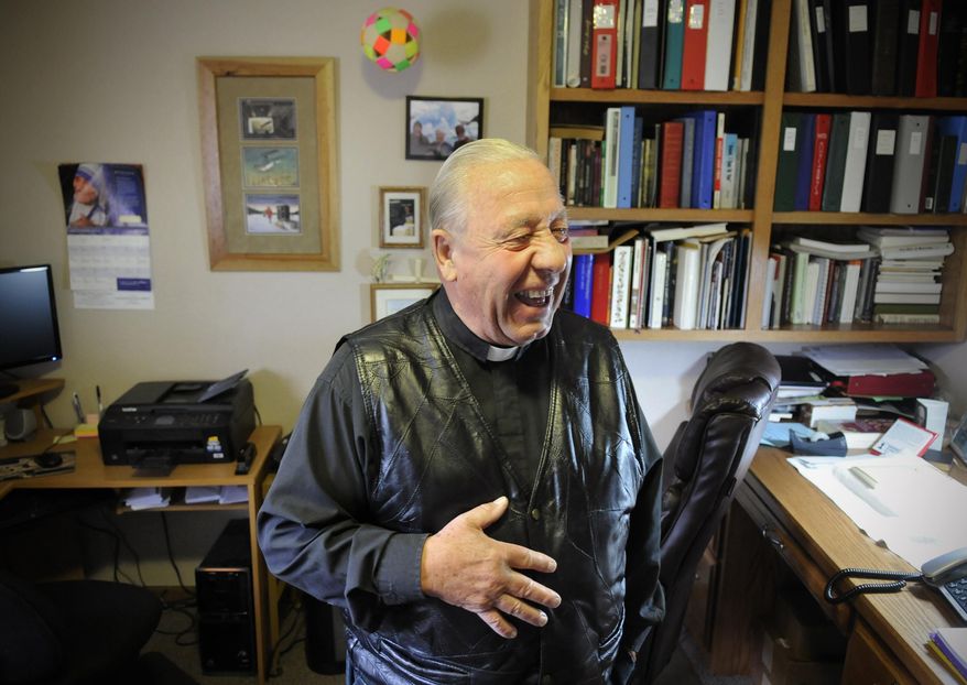 FOR RELEASE MONDAY, OCTOBER 27, 2014, AT 12:01 A.M. CDT.- Father Julius Beckerman shares a laugh in his office at the Jacob's Prairie, Minn., parish house near Cold Spring, Minn., Wednesday, Oct. 1. (AP Photo/The St. Cloud Times, Dave Schwarz)
