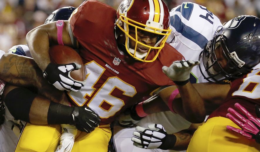 Washington Redskins running back Alfred Morris (46) carries the ball during the first half of an NFL football game against the Seattle Seahawks in Landover, Md., Monday, Oct. 6, 2014. (AP Photo/Alex Brandon)