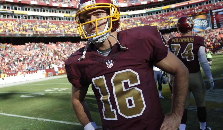 Washington Redskins quarterback Colt McCoy (16) stands on the field after an NFL football game against the Tennessee Titans, Sunday, Oct. 19, 2014, in Landover, Md. The Redskins won 19-17. (AP Photo/Pablo Martinez Monsivais)
