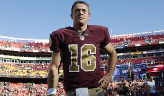 Washington Redskins quarterback Colt McCoy (16) stands on the field after an NFL football game against the Tennessee Titans, Sunday, Oct. 19, 2014, in Landover, Md. The Redskins won 19-17. (AP Photo/Pablo Martinez Monsivais)
